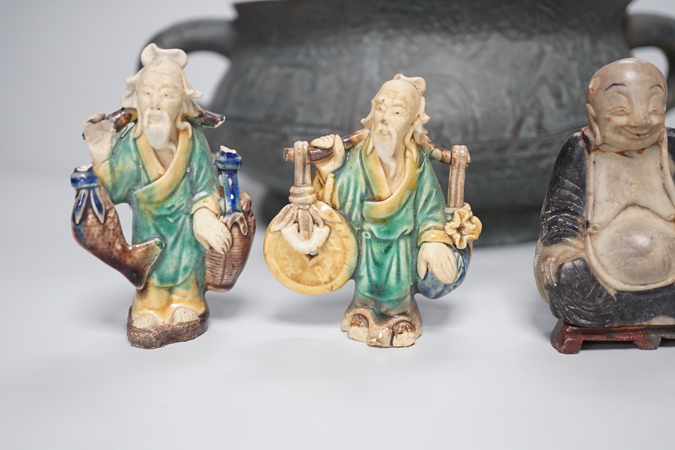 A large late 19th/early 20th century Chinese bronze censer, gui, Xuande mark, together with four Chinese figures. Tallest 12cm